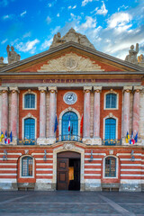 Toulouse is the capital of the Occitania region in southern France. It is divided by the Garonne River and is located near the border with Spain. It is known as La Ville Rose