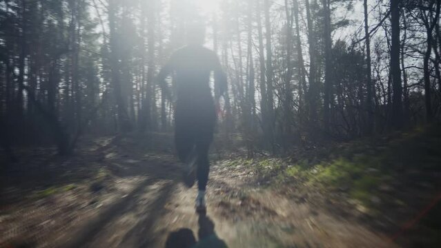 Marathon runner doing cardio cross training by running on trail	