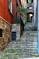 Varenna, Province Lecco,  Lombardy, Italy, Europe - narrow colorful street in historic part of touristic resort located on Lake Como shore