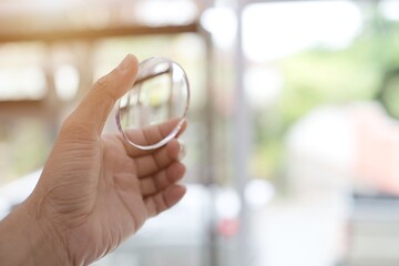 person holding a magnifying glass