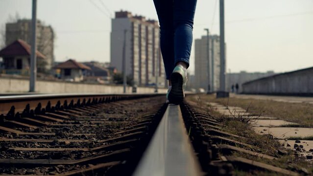 Happy dreamer on old railroad rail . Rust on steel railroad rail	
