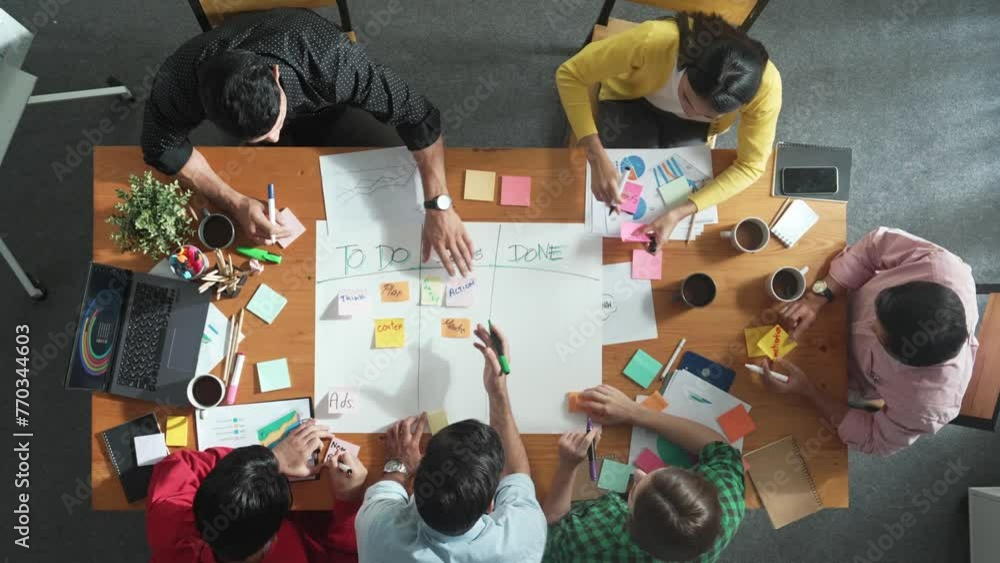 Poster top down aerial view of diverse business team making scrum task board at meeting room. group of smar