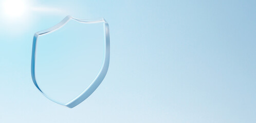 青空に透明なガラスの盾。太陽の光。コピースペース。3D（横長）