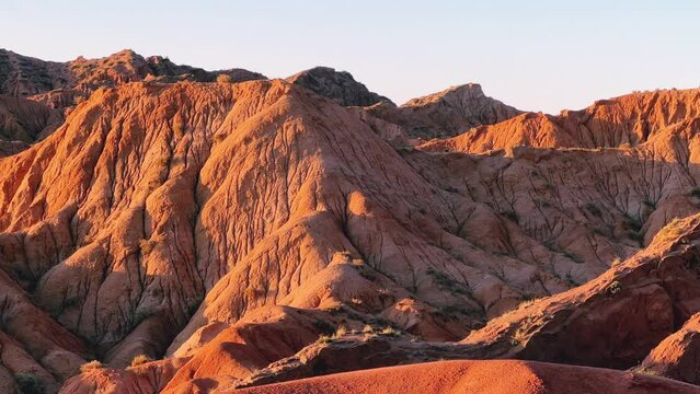 A fabulous canyon in Central Asia. Scenic view of a beautiful textured multi-layered canyon. Mountain ranges in a fabulous canyon at sunset near Lake Issyk-Kul in Karakol. 4K