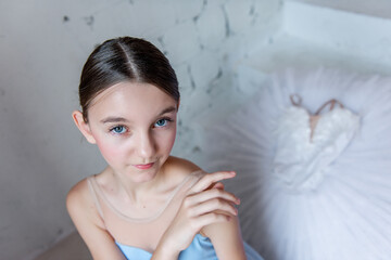 Close up portrait of Ballerinas Overhead Gaze with Tutu in Background. Evocative overhead shot...