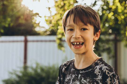 Portrait of a smiling boy on the street on a summer’s day