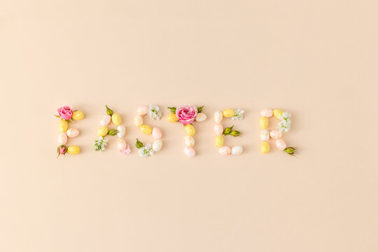 The word "EASTER" spelled out with colorful eggs and  flowers