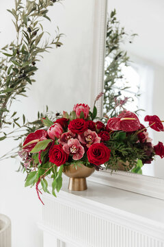 Vibrant Large Shades of Red Floral Arrangement in Gold Vase
