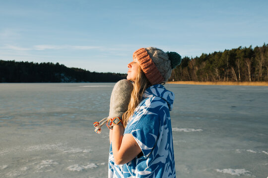 woman getting some vitamin D before taking an ice bath in a lake