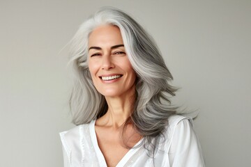 Portrait of a beautiful middle-aged woman with grey hair - obrazy, fototapety, plakaty