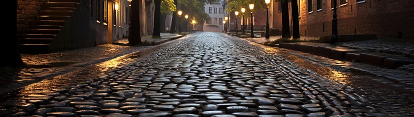 Zelfklevend Fotobehang Smal steegje Interlocking cobblestone street glistening after a fresh rain.