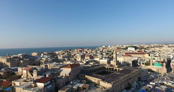 Panoramic Aerial View of Acco, Acre, Akko old city with crusader palace, city walls, arab market, knights hall, crusader tunnels, in Israel. Green Roof Al Jazzar Mosque