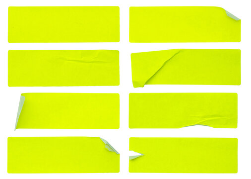 A set of fluorescent neon yellow rectangular paper sticker label isolated on white background.