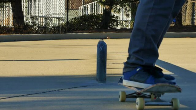 Skater does a trick on a rail at the skate park