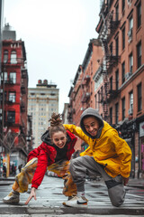 portrait of young couple of african american and caucasian teenagers dancing breakdance style, detail of the motion, generation z lifestyle - obrazy, fototapety, plakaty