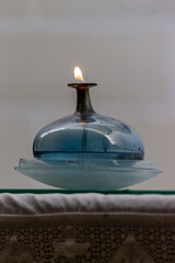 candle on the table - obrazy, fototapety, plakaty