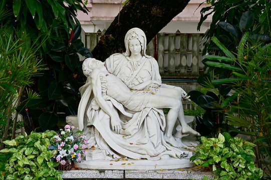 Closeup of Statue of Our lady and Jesus in catholic church with natural background at Thailand. selective focus