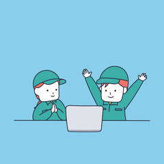 パソコンの画面を見て喜ぶ作業服を着た男女2人