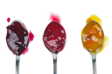 Three colored jam on a spoon isolated on a white background