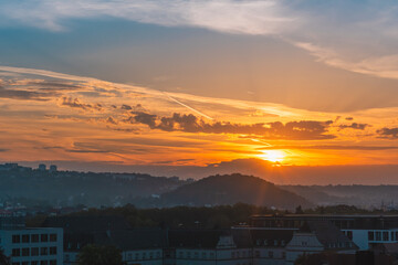 Bright sun shining over the cloudy horizon landscape