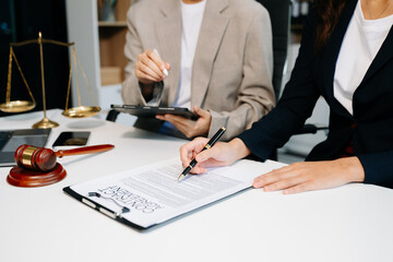 .business people and lawyers discussing contract papers sitting at the table. Concepts of law, advice, legal services. in morning light.