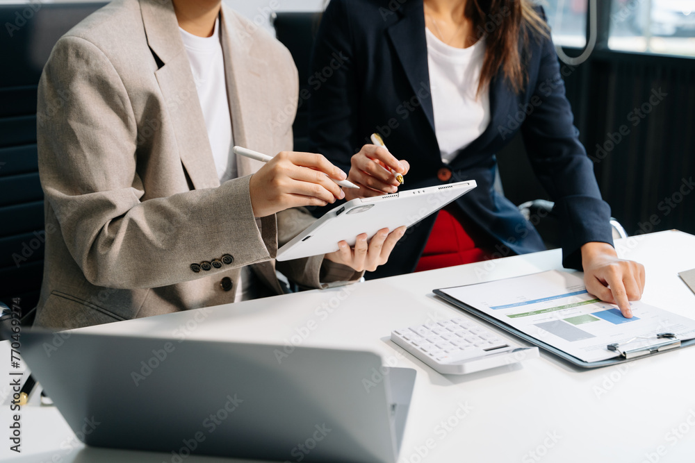 Poster business documents on office table with smart phone and calculator digital tablet and graph business