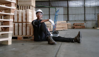 Multiracial engineer, worker sitting resting on floor feel tired from overworked in factory. Young...