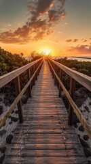 Long wooden dock leads out into calm body of water as sun sets behind it. Sky ablaze with color, water reflects warm hues. Dock made of weathered wood, railing covered in cobwebs. Water still, calm. - obrazy, fototapety, plakaty