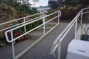 ramp alongside stairs to public rest rooms in a tourist pilgrimage site
