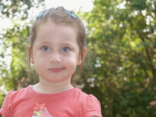 European blue-eyed girl smiling in nature