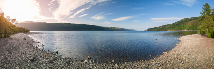 Drone panorama showcases Loch Ness in its full glory, with the sunlight casting a soft glow over...