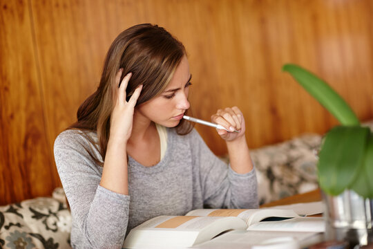 Woman, thoughts and home with textbook to study for university exams or test and reading notes. Thinking, female person and happy as college student in living room for distance learning and revision