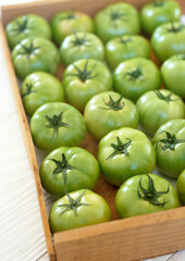 Green tomatoes in a box