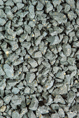 Construction Materials Concepts. Closeup Image of Background Made of Pile of Gray Crushed Stone.
