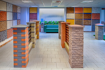 Modern Showroom of Construction Materials Production Company With Equipment and Decorated Walls.