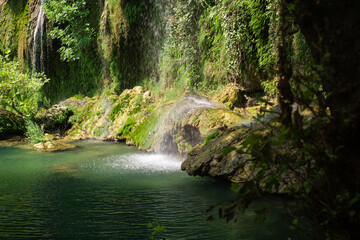 Discover nature's wonders: a waterfall in lush green park. Ideal for eco-tourism, hiking excursions, and exploring natural reserves and landmarks.