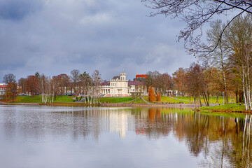 Scenic View of Museum of Druskininkai in Lithuania From Point of Pond Near Forest in Autumn Colors - 770489029