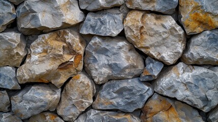 Multi-colored rough stone wall providing a richly textured natural background.