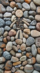 Pebble art of a human figure on a stone background