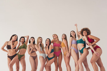 Photo of ten girls lesbians different bodies and imperfections satisfied posing in underwear at white studio background - obrazy, fototapety, plakaty