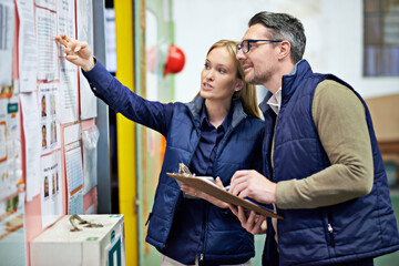 People, business and checking schedule with board in warehouse with calendar for order details....