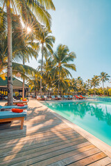 Happy tourism holiday landscape. Luxury beach resort hotel swimming pool, leisure beach chairs under umbrellas palm trees, blue sunny sky. Summer island seaside, relax mood travel vacation background