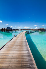 Maldives water villas paradise background. Tropical landscape, seascape with long pier, water villas, amazing sea sky and lagoon beach, tropical nature. Exotic tourism destination, summer vacation - 770528281