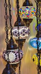 Beautiful lamps in Arabic style. Colorful hanging lanterns in traditional Arabic style handmade in the souvenir shop