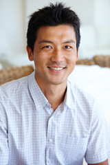Asian man, portrait and startup or entrepreneur with smile at home, happiness or glee with...