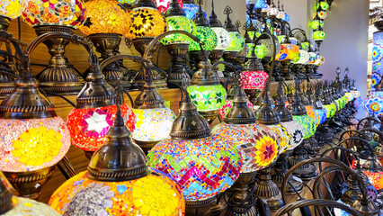 Mosaic of colored glass. Illuminated in the evening, it creates a cozy atmosphere. Vintage multicolored lamps in traditional Oriental style, Arab-style lanterns