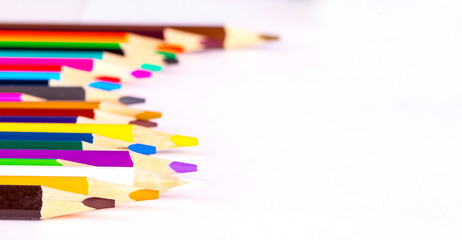 Colored pencils on a white background. Selective focus - obrazy, fototapety, plakaty