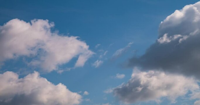 timelapse of sky background with tiny fluffy clouds in windy day