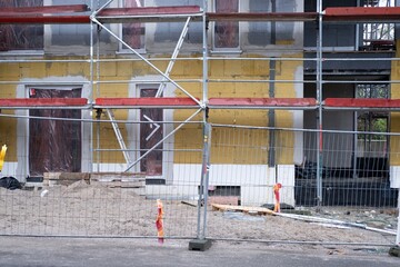 Naklejka premium house construction site with scaffolding