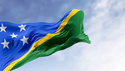 Detail of the national flag of Solomon Islands waving in the wind on a clear day - 770546643